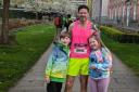 Twins Frankie and Isabella Stocker with proud dad Steve after his marathon debut in Manchester.