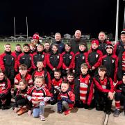 Rhyl Rugby Club under-10s with manager/coach Kelly Taylor-Jones, Geraint Hughes (Anwyl Homes), Leigh Hymus-Gant (Sovereign Funeral Services), and coaches Chris Fellcrook and Gary Evans. Photo: Brian Hill