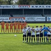 A minute's silence in memory of Ron Jones is held prior to Rhyl's match against Conwy Borough
