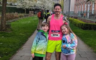 Twins Frankie and Isabella Stocker with proud dad Steve after his marathon debut in Manchester.