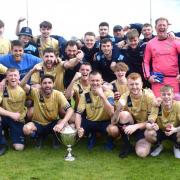 Kinmel Bay's players celebrate with the Cookson Cup