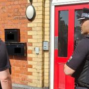 Police visit a home in Rhyl West.