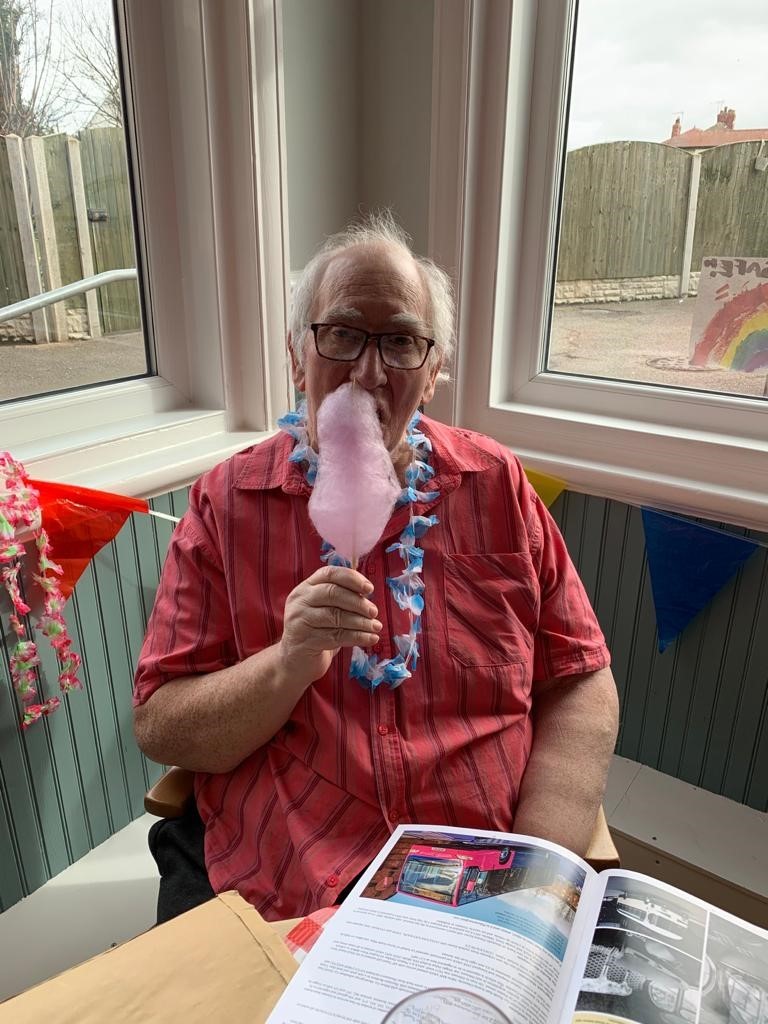 One of the residents enjoying candy floss!