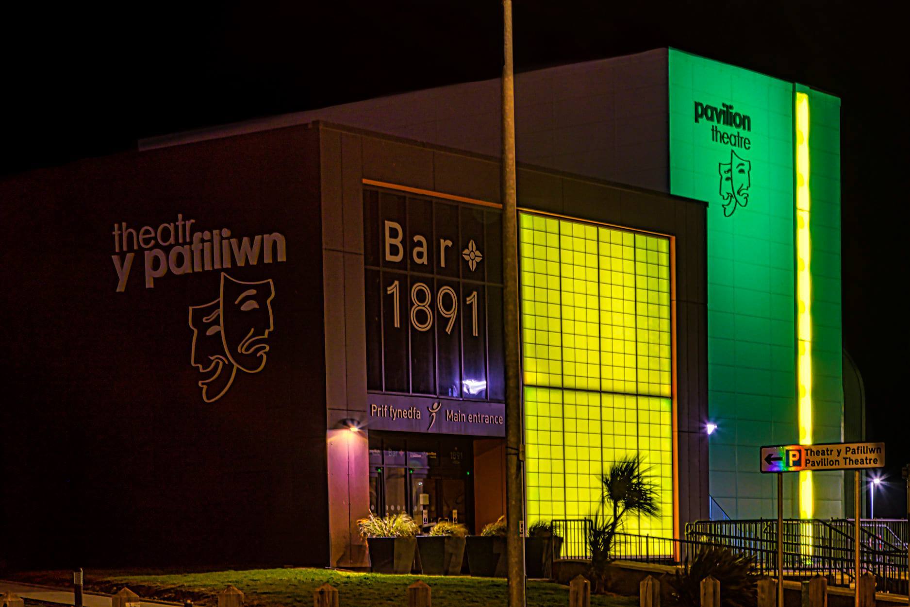 Rhyl Pavilion Theatre is lit up yellow. Picture: Barry Johnson / Rhyl Journal Camera Club Facebook