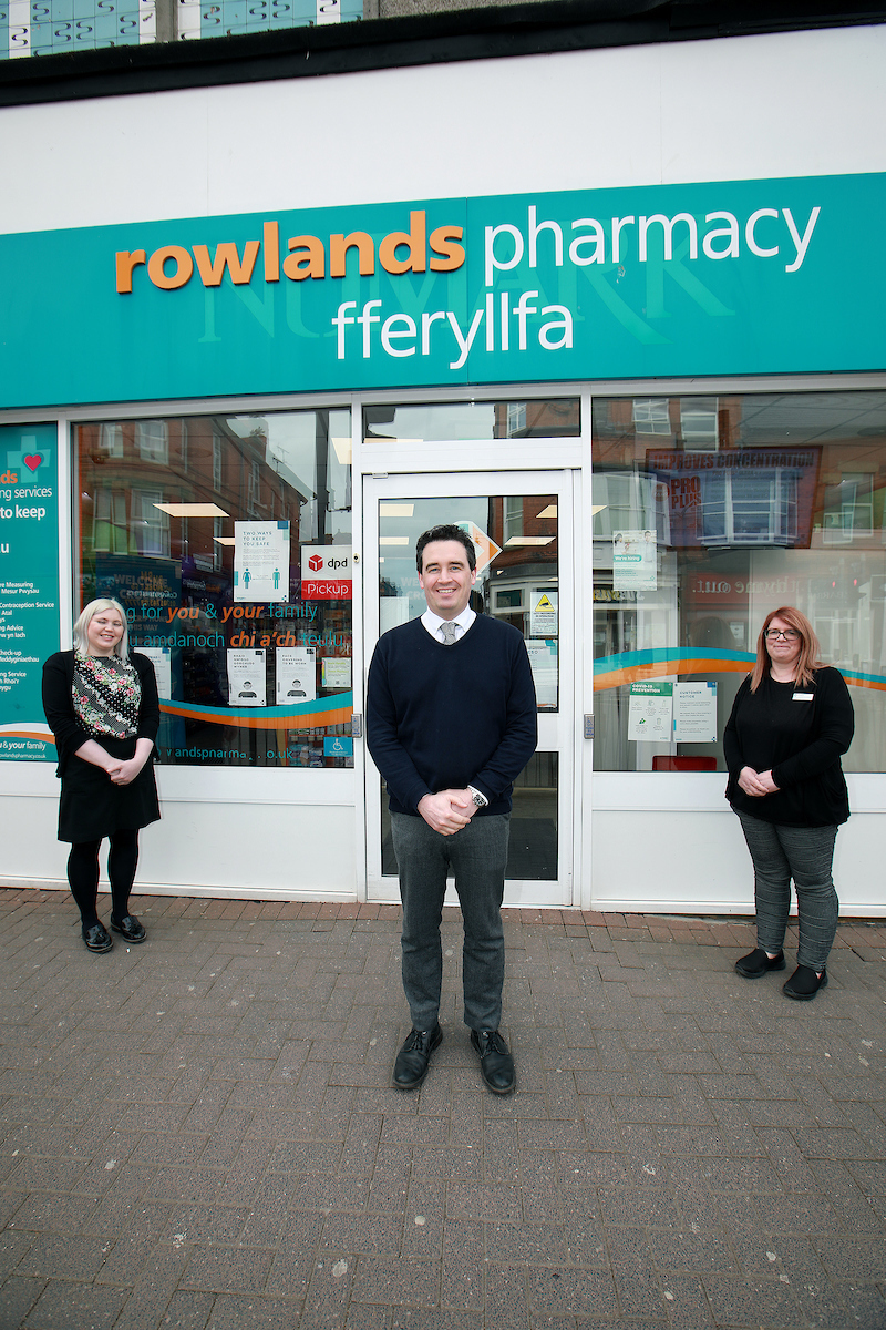 James Davies MP with Rowlands Pharmacy Manager Kim Noble and Pharmacist Amy Crofts.