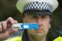 A police officer with a drugs test