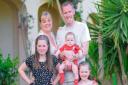 Amy Wildman with her husband and three of her four children.