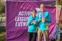 Liz and Karl Martin proudly display their “Triple Medals” after completing the Chester Marathon
