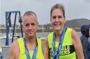 Warren Brown and Sarah Brooks moments after finishing the Conwy Half Marathon