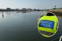 Pwllheli Marina. Inset: North Wales Police jacket