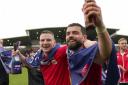 Wrexham AFC stars Paul Mullin and Elliot Lee enjoy their promotion from EFL League Two.