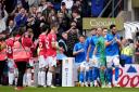 The Wrexham players give Stockport a guard of honour