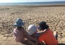 Family on the beach at Rhyl. Photo: Allen Heard