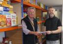 (L/R) Rhyl Rotary Club President Gordon Marshall and Pastor Mike Bettaney of Wellspring Church Foodbank.
