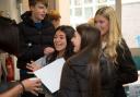 GCSE students collect their results.