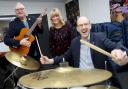 Llyr Gruffydd North Wales MS at Music Co-operative with head of service Heather Powell and chair, cllr Mark Young.