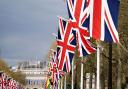 Union flags hang from the street furniture outside Buckingham Palace on the Mall, London, ahead of the coronation of King Charles III on Saturday May 6. Picture: PA