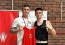 Joe Wright (right) with his boxing coach after being crowned a national champion