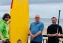 Pictured Lewis Guerrero of the Kitesurfing cafe; cllr Mark Young and cllr Martyn Hogg.