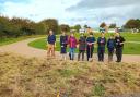 Ysgol Tir Morfa students helping the wildflower meadow.