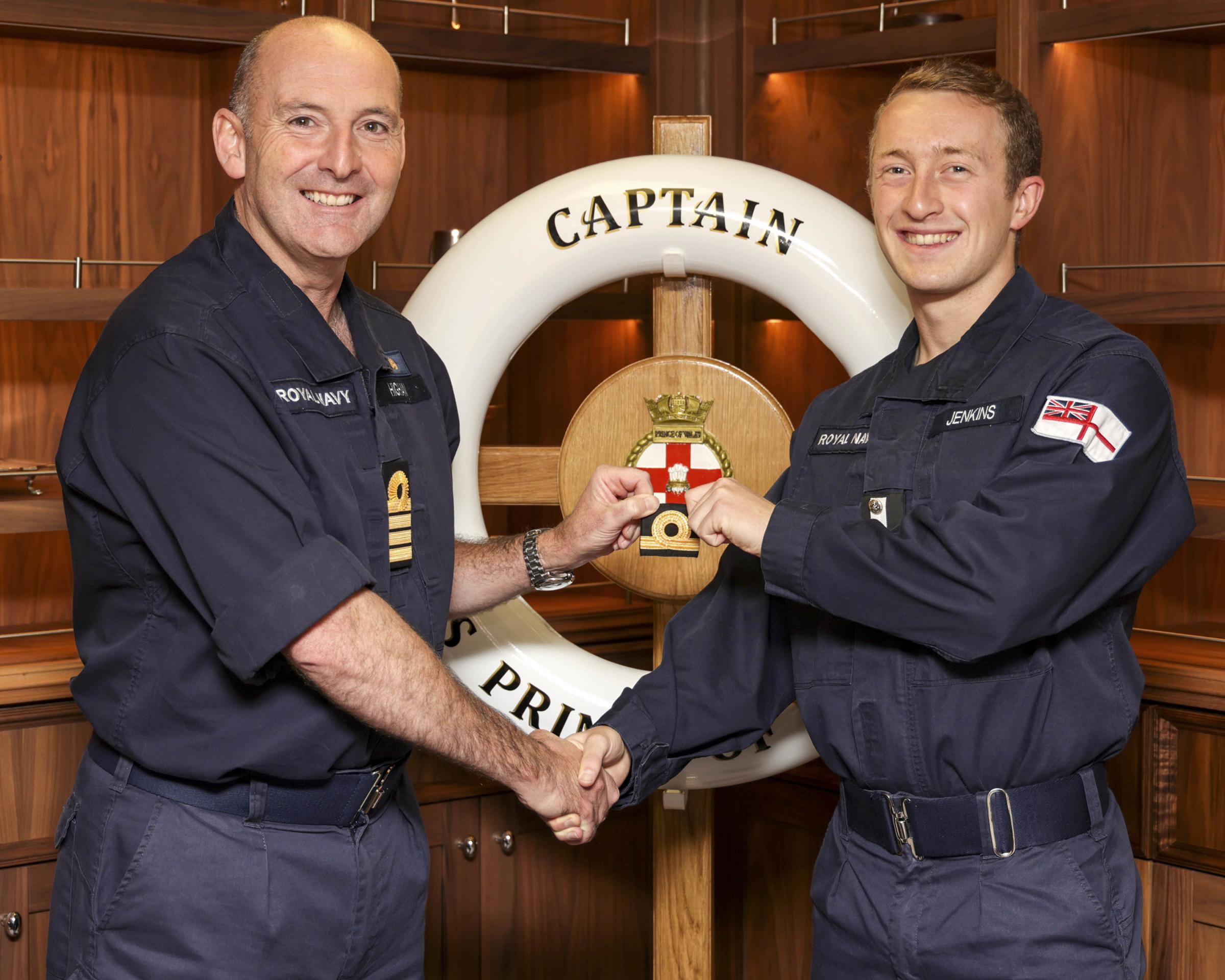 Pictured: SLt Daniel Jenkins gains promotion in a presentation from Captain Stephen Higham OBE RN on board HMS prince of Wales. HMS Prince of Wales - Promotion Board Presentations. HMS Prince of Wales is at sea with embarked F35 Lightning jets from 207