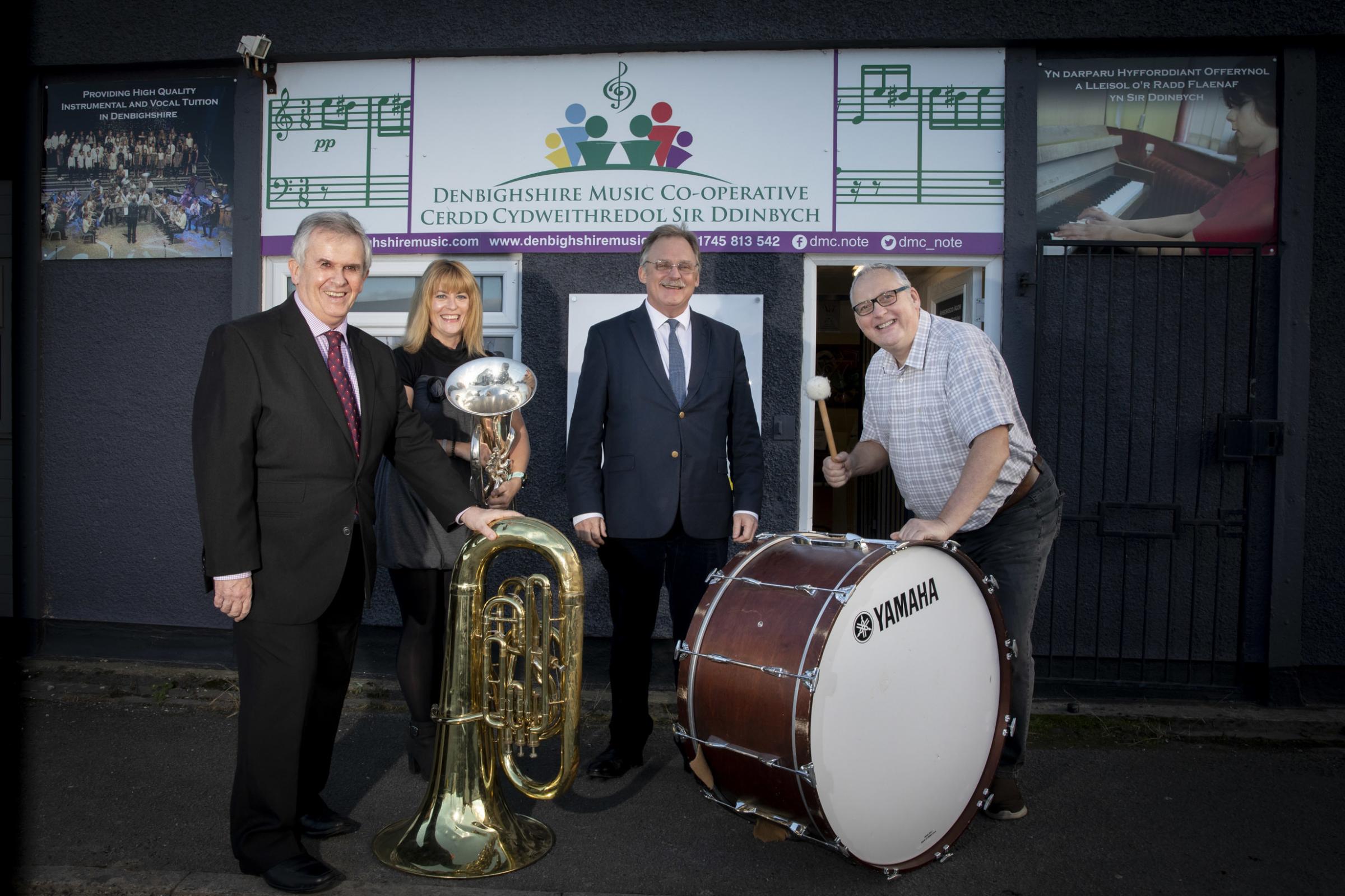 MS Mark Isherwood with Cllr Mark Young, Cooperative chair; Mike Williams, business advisor for social business Wales; and Heather Powell, Music Co-operative founder and head of service. Picture: Mandy Jones