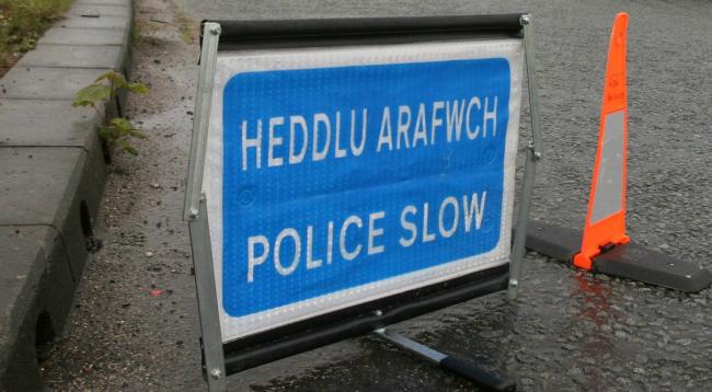 Library image of police 'slow' warning sign