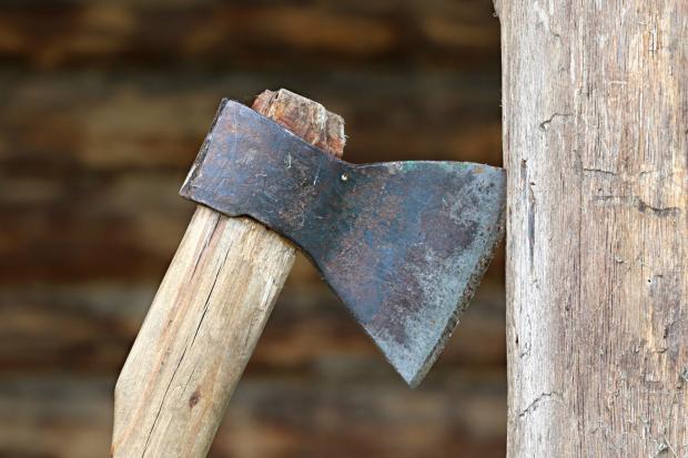 Rhyl Journal: An axe touching wood. Credit: Canva