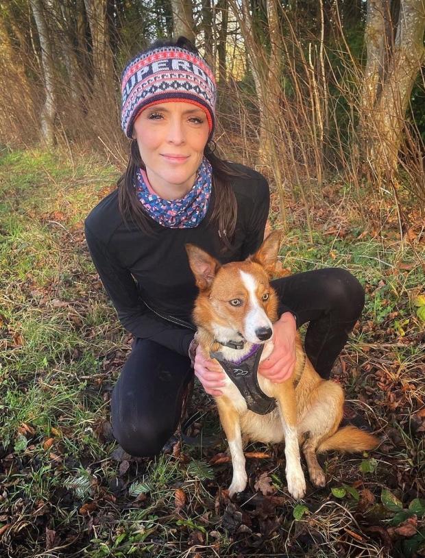 Rhyl Journal: Charlotte Rose Wilton-Jones with Ottie, who made his debut at the Canicross trail race. Photo: Charlotte Rose Wilton-Jones
