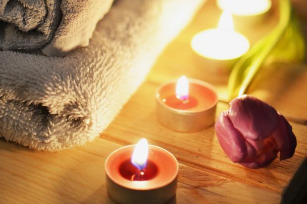 Rhyl Journal: A pile of towels, candles and a tulip. Credit: Canva