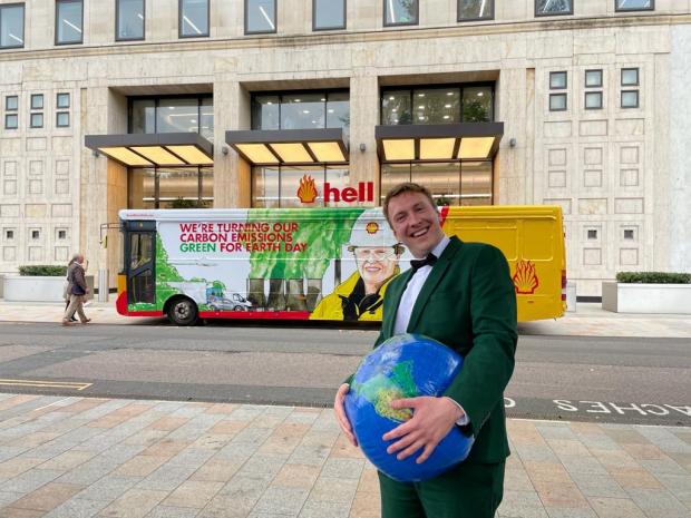 Rhyl Journal: Joe Lycett outside of Shell's Headquarters in London, perfoming a stunt as part of his documentary Joe Lycett vs The Oil Giant, which explores the energy company, its marketing and its exploration for new oil reserves. Photo via PA.
