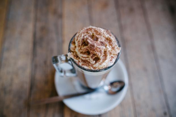 Rhyl Journal: A hot chocolate topped with cream and sprinkles (Canva)
