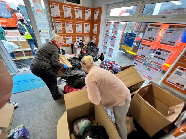 Rhyl Journal: Volunteers helped sort the many donations for free. Photo: Chris Gentile