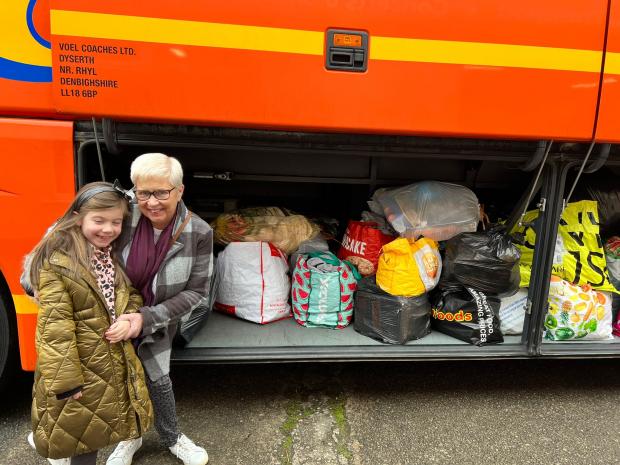 Rhyl Journal: People of all ages chipped in to help for free. Photo: Chris Gentile
