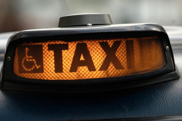 File image of sign on a taxi.