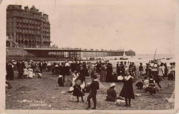 Rhyl Journal: The Pier viewed from the sands of Llandudno, shortly after opening. Photo: Home Front Museum