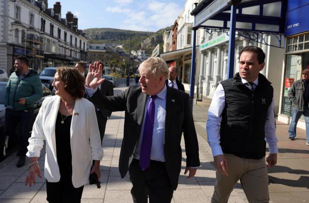 Rhyl Journal: Prime Minister Boris Johnson on the campaign trail with Janet-Finch Saunders Robin Millar in Llandudno, North Wales. Picture by Andrew Parsons / Parsons Media