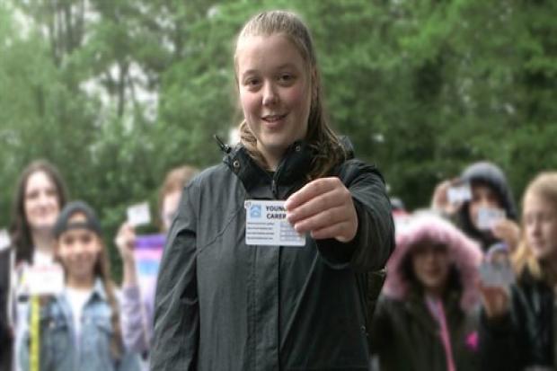 A young carer with their Young Carer ID card. Picture: Torfaen council.
