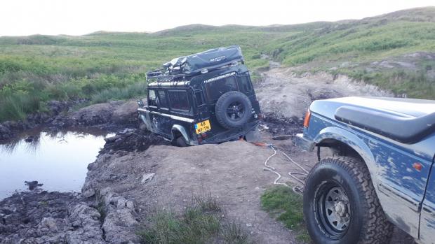 Rhyl Journal: The 4x4 being winched out of the mud. Photo: North Wales 4x4 Response Group