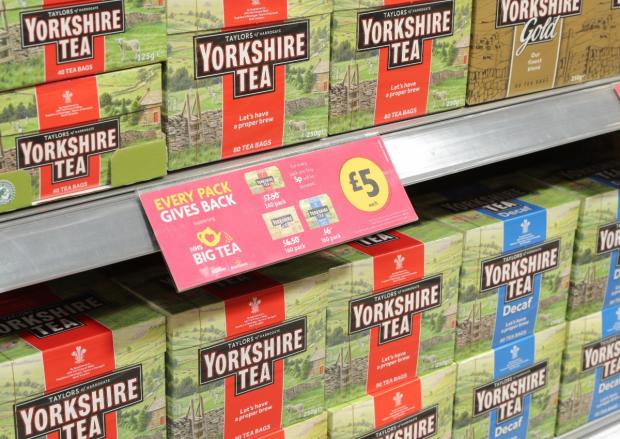 Rhyl Journal: Teabags on shelves and a Every Pack Gives Back label at a Morrisons store (Morrisons)