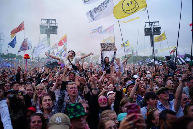 A variety of funny and colourful flags have been seen at this year's Glastonbury (PA)