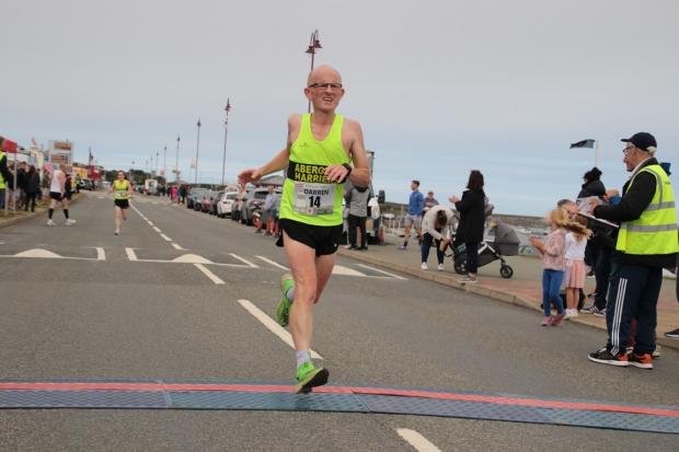 Darren Blazier, from Rhyl, running in the Holyhead Breakwater five-mile race.