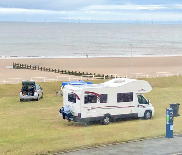 Rhyl Journal: Some of the vehicles which were parked on the grass at the promenade earlier this week