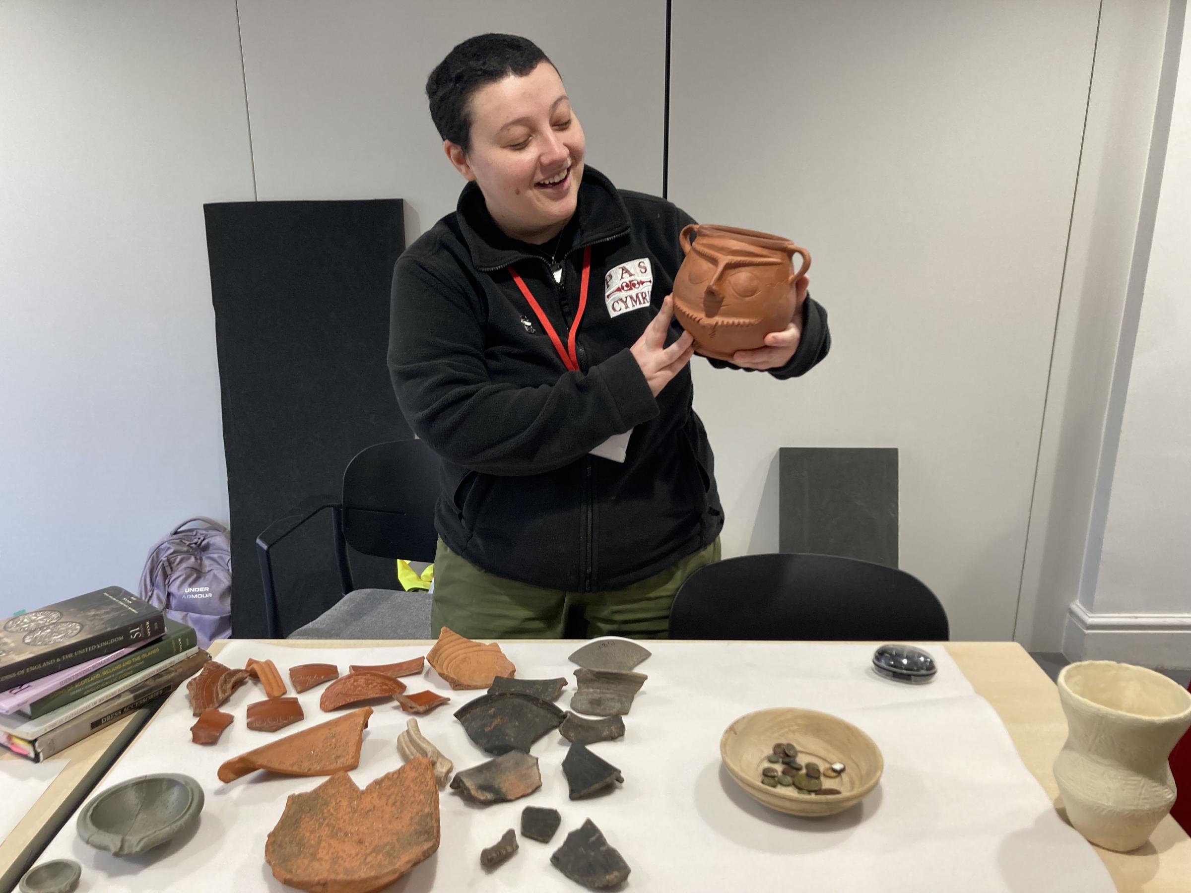 Clara De Sousa Cunha with Roman Pottery finds and a recreated Roman clay pot she made (Image Dale Spridgeon)