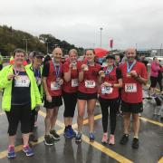 Soaked but happy - the Prestatyn Running Club members after completing the Porth Eirias 10k in Colwyn Bay