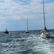 Hoylake Lifeboat tows the yacht while Rhyl Lifeboat escorts the catamaran. Picture: Hoylake RNLI