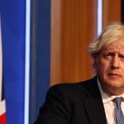 Photo shows Boris Johnson during a coronavirus press conference. Photo via PA/Adrian Dennis.