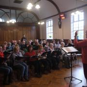 The two choirs practising together for their previous concert in 2018. Picture: Richard Steventon