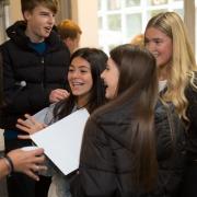 GCSE students collect their results.