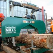 The sawmill in action with Cob Project Manager Nicky Hodge and volunteer Kyle Street.